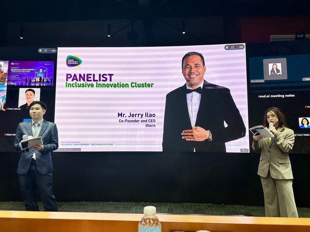The AIM MIB Capstone Demo Day screen introducing Jerry Ilao as panelist for the Inclusive Innovation cluster