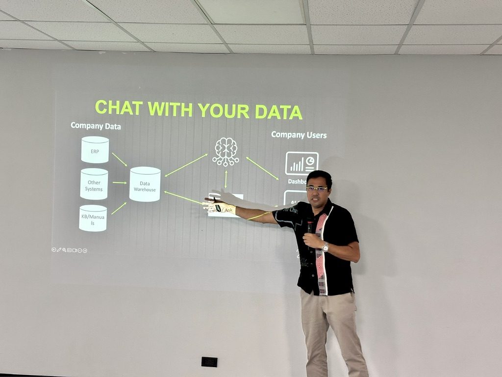 Jerry Ilao presenting the chat-with-your-data architecture at the Lapanday AI workshop — ERP and company systems feeding a data warehouse that leaders query with AI