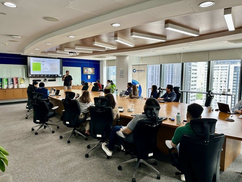 Republic Cement AI Champions reviewing the Microsoft Copilot agent ideas they submitted before the workshop
