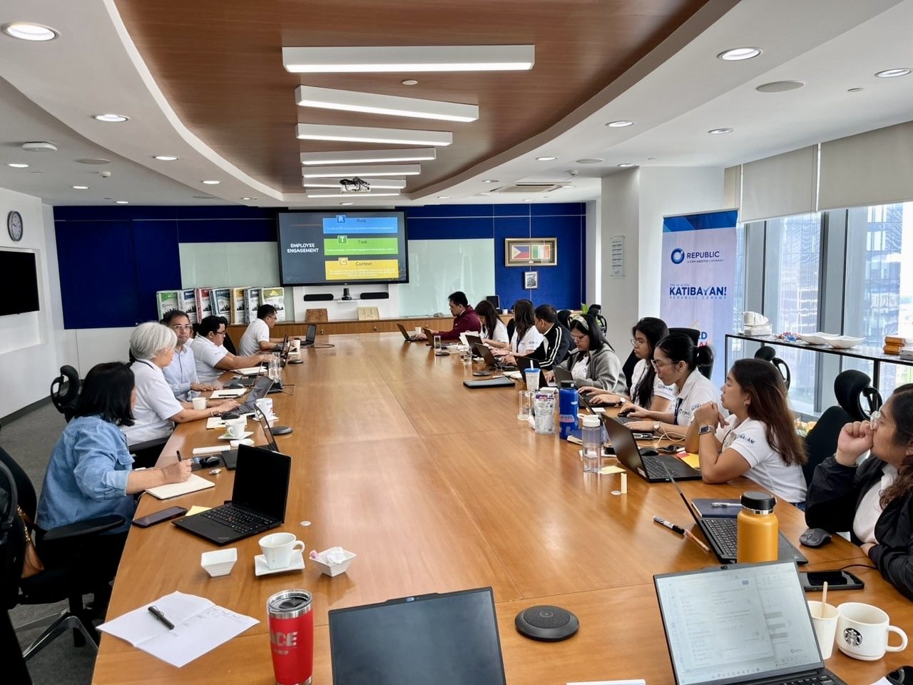 Corporate boardroom learning a practical prompting framework at an in-person AI workshop