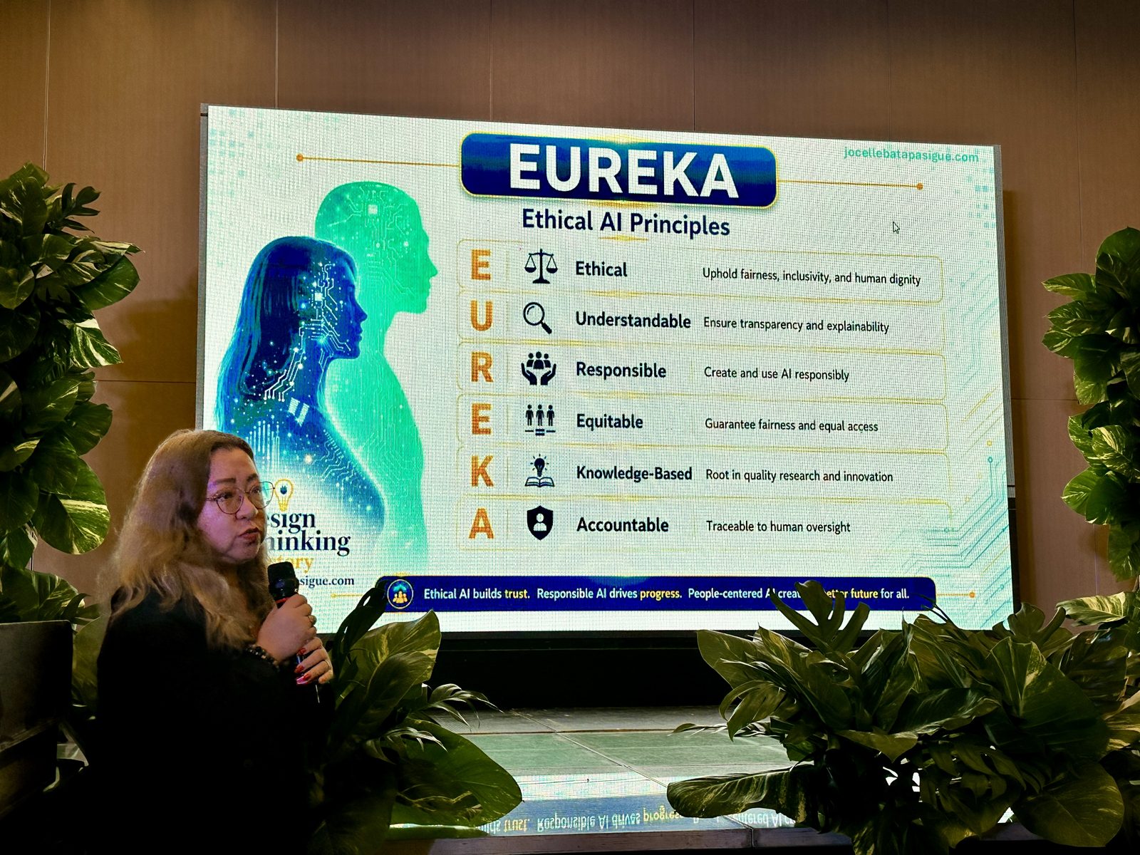Atty. Batapa-Sigue beside her EUREKA slide listing six ethical AI principles: Ethical, Understandable, Responsible, Equitable, Knowledge-Based, Accountable