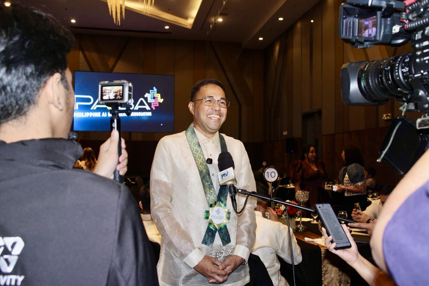 Jerry Ilao interviewed by media at a PAIBA event